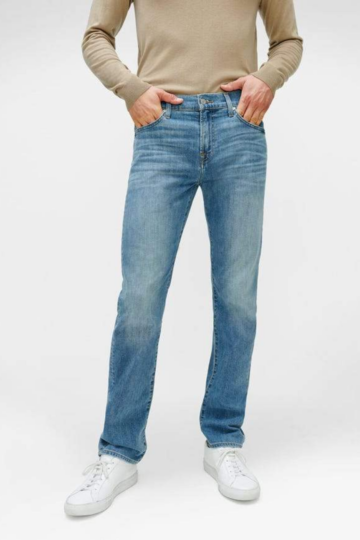 A slimmer straight fit in incredibly soft Italian denim with great retention—features a light indigo wash, silver hardware, & grey labels.